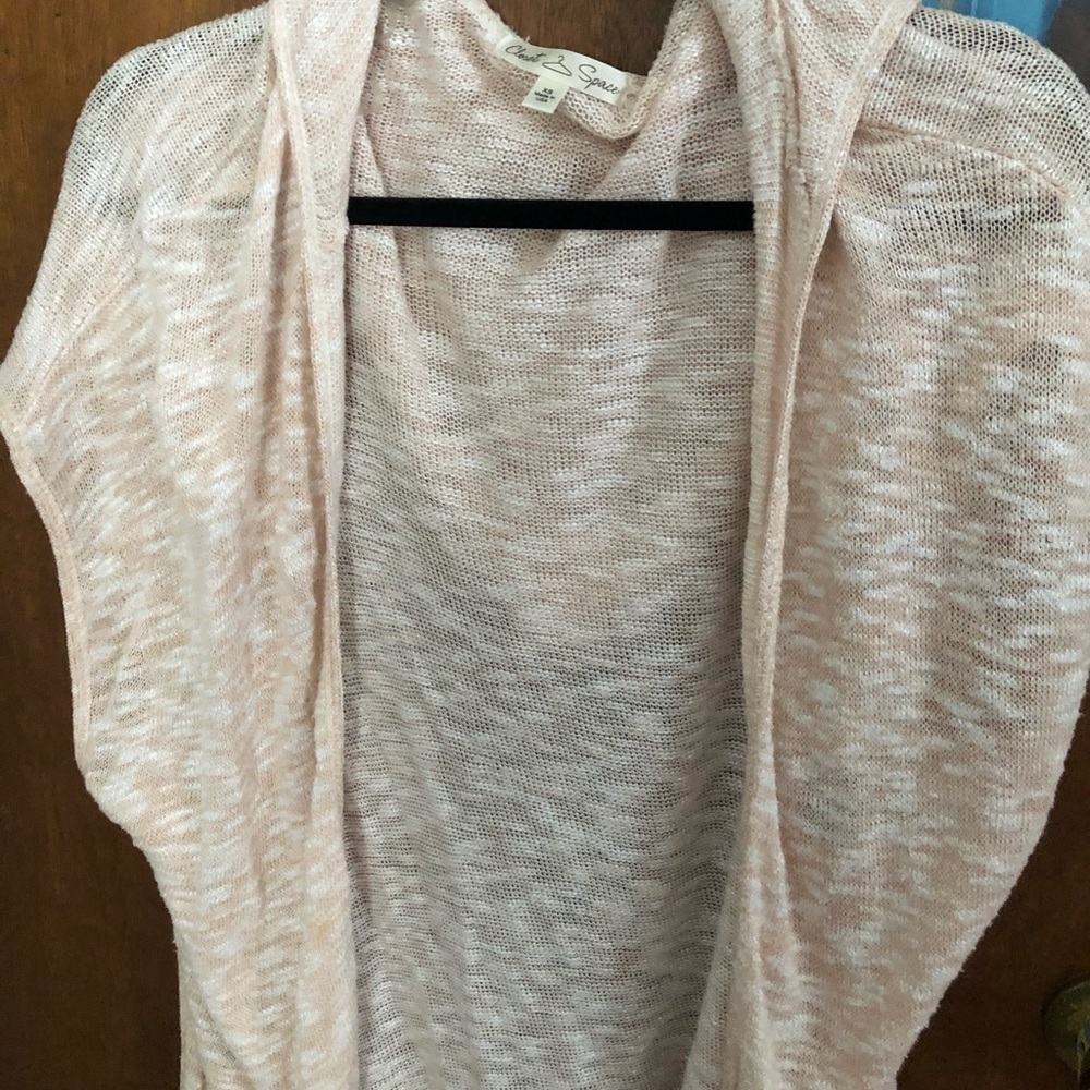 Pink and white sleeveless cardigan